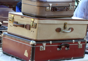 three old leather suitcases  at the market of vintage and retro